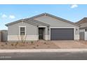 Single-story home featuring neutral paint, desert landscaping, and a two-car garage at 4777 W Hunter Trl, San Tan Valley, AZ 85144