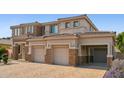Charming home featuring multi-car garage, driveway, and appealing stonework at 5557 W Mine Trl, Phoenix, AZ 85083