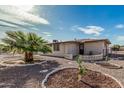 Palm tree and desert landscaping in the backyard of home at 6722 E El Paso St, Mesa, AZ 85205