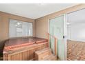 Enclosed hot tub room with access to bonus room and fenced backyard at 6722 E El Paso St, Mesa, AZ 85205