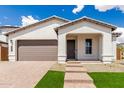 Inviting front exterior of a single-story home with a well-maintained lawn and tiled roof at 7342 W Hedge Hog Pl, Peoria, AZ 85383
