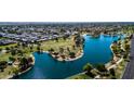 Beautiful aerial view of the property near a lake and lush green park at 8113 E Vista Dr, Scottsdale, AZ 85250