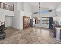 Bright, open living room with tile floors, high ceilings, and large windows, perfect for entertaining at 11183 W Tonto St, Avondale, AZ 85323