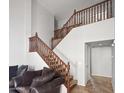 Elegant staircase with wooden banister, leading to the upper level of this beautiful home at 11183 W Tonto St, Avondale, AZ 85323