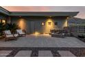 Charming backyard patio featuring seating, a stylish water feature, and desert landscaping at 11935 E Casitas Del Rio Dr, Scottsdale, AZ 85255