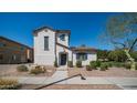 Charming two-story home with low maintenance landscaping and inviting front entrance at 15024 N 142Nd Ln, Surprise, AZ 85379