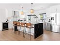 Bright kitchen with white cabinets, black countertops and stainless steel appliances at 1609 W State Ave, Phoenix, AZ 85021