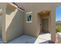 Front porch features neutral stucco, an arched doorway, and a charming entrance at 3597 E Appaloosa Dr, San Tan Valley, AZ 85140