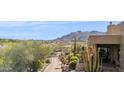 Front exterior with desert landscaping and a mountain view at 38199 N Tranquil Way, Carefree, AZ 85377
