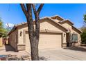 Well-maintained home with a two-car garage and a durable, neutral-toned exterior at 4076 E Silverbell Rd, San Tan Valley, AZ 85143