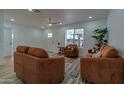 Comfortable living room with ample seating, neutral walls, and an inviting atmosphere for relaxation at 4109 N 30Th Ave, Phoenix, AZ 85017