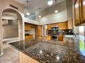 Spacious kitchen with granite countertops, stainless steel appliances, and a large island at 4867 E Windstone Trl, Cave Creek, AZ 85331
