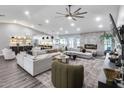 Spacious living room features a large sectional, fireplace, and a view of the kitchen at 5975 E Larkspur Dr, Scottsdale, AZ 85254