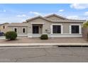 Inviting single-story home with a neutral facade, tiled roof, and desert-style landscaping at 6228 S Nash Way, Chandler, AZ 85249
