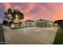 Beautiful home featuring modern exterior, well-kept lawn, and extended driveway leading to garage at 8229 E Devonshire Ave, Scottsdale, AZ 85251