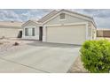 Charming single-story home with a well-maintained driveway and attached two-car garage at 1005 W 19Th Ave, Apache Junction, AZ 85120
