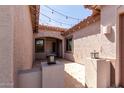 Covered entry with string lights, decorative lanterns, and a neutral color scheme at 1123 E Buckingham Ave, Gilbert, AZ 85297