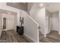 Welcoming foyer with stylish flooring, staircase, and modern decor, creating a warm first impression at 15604 N 173Rd Ln, Surprise, AZ 85388