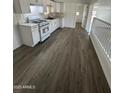 Bright, updated kitchen with white cabinets, marble-look countertops, and new appliances at 2027 E Michelle Dr, Phoenix, AZ 85022