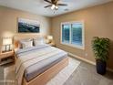 Cozy bedroom with comfortable bed, soft lighting, and serene decor at 2088 N 164Th Ave, Goodyear, AZ 85395