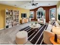 Bright living room featuring large windows, contemporary furniture, and stylish striped rug at 2088 N 164Th Ave, Goodyear, AZ 85395