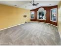 Spacious living room with neutral carpet, large windows, and ample natural light at 2088 N 164Th Ave, Goodyear, AZ 85395