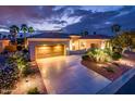 Charming single-story home featuring a tile roof, spacious driveway, and lush desert landscaping at 22912 N San Ramon Ct, Sun City West, AZ 85375