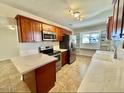 Updated kitchen features stainless appliances, quartz countertops, ample cabinet and counter space at 2533 E Flower St, Phoenix, AZ 85016