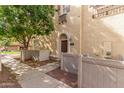 Charming townhome exterior with a quaint balcony and well-kept landscaping at 2754 S Sulley Dr # 103, Gilbert, AZ 85295