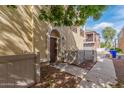 Inviting front entrance with a charming archway, creating a warm welcome at 2754 S Sulley Dr # 103, Gilbert, AZ 85295