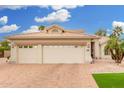 Beautiful single-Gathering home featuring manicured landscaping, a three-car garage, and a lovely tile roof at 3150 N 150Th Dr, Goodyear, AZ 85395