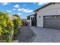 View of the gray driveway and flowers in the landscaping at 3842 E Alameda Ln, Gilbert, AZ 85298
