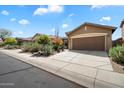 Beautiful single-story home featuring a 2-car garage and desert landscaping at 40055 N High Noon Way, Anthem, AZ 85086