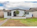 Charming single-story home with a well-maintained front yard and inviting curb appeal at 4213 W Medlock Dr, Phoenix, AZ 85019