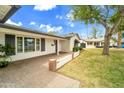Charming covered entryway with brick accents and well-maintained landscaping at 4611 E Monterosa St, Phoenix, AZ 85018