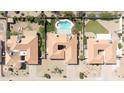 Overhead shot displays this home and its neighbors, highlighting private pool, and desert landscaping at 5719 E Paradise Ln, Scottsdale, AZ 85254