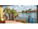 Outdoor patio area overlooking calm lake waters with palm trees at 8935 W Acoma Dr, Peoria, AZ 85381