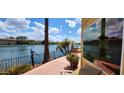 Patio and lake view with desert landscaping and lounge chairs at 8935 W Acoma Dr, Peoria, AZ 85381