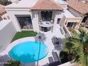 Aerial view of a house showcasing a swimming pool and outdoor patio area at 10113 E Topaz Dr, Scottsdale, AZ 85258