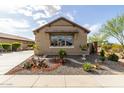 Lovely single-story home with desert landscaping offering curb appeal in a desirable community at 11571 E Chevelon Trl, Gold Canyon, AZ 85118