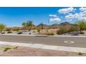 Desert landscape street view with beautiful mountain backdrop and clear, blue sky at 11738 S 173Rd Ln, Goodyear, AZ 85338