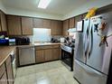 Functional kitchen features stainless steel appliances, ample countertop space, and classic cabinetry at 141 N Date -- # 7, Mesa, AZ 85201