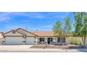 Charming single-story home featuring a well-maintained yard and a two-car garage at 1617 E Fremont Rd, Phoenix, AZ 85042