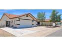Spacious three-car garage and driveway offer ample parking at 1617 E Fremont Rd, Phoenix, AZ 85042