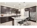 Stylish kitchen boasting granite countertops, stainless steel appliances, ample cabinetry, and barstool seating at 1930 W Yellowstone Way, Chandler, AZ 85248