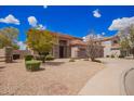 Landscaped front yard with desert landscaping and mature trees at 2146 S Drexel --, Mesa, AZ 85209