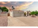 Exterior view of home showing desert rock front yard and two car garage and walkway to front door at 3308 N Nebraska St, Chandler, AZ 85225