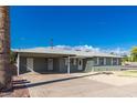 Inviting single-story home featuring a spacious covered carport and a low maintenance front yard at 3502 W Gardenia Ave, Phoenix, AZ 85051