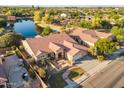 Aerial view of home with tile roof, mature landscaping, and a spacious driveway at 3750 E Sawtooth Dr, Chandler, AZ 85249