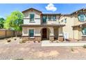 Charming two-story home with stone accents and arched entryway, perfect for a Gathering at 3841 E Jasper Dr, Gilbert, AZ 85296